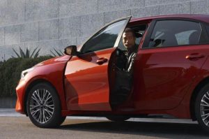 Open Door of Red 2022 Kia Forte