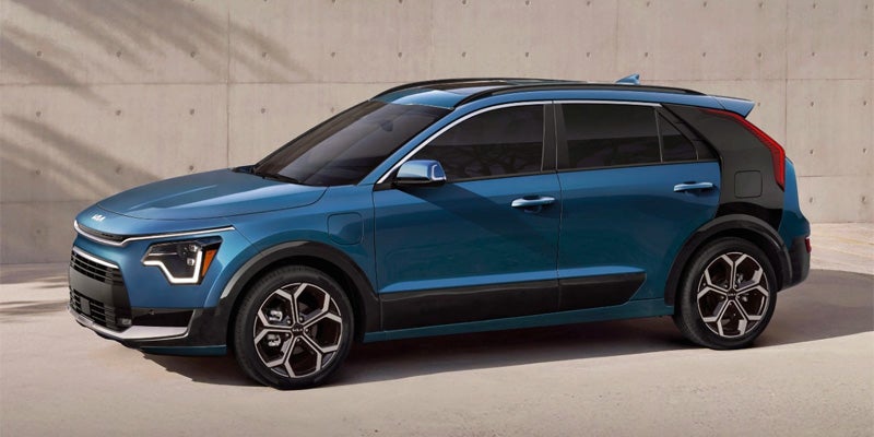 left and side view of a blue 2024 kia niro phev