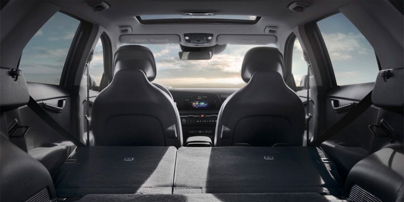 interior view of 2024 kia niro phev open hatchback with backseats folded down